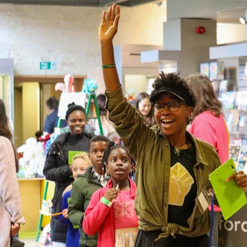 storyteller leading line of children
