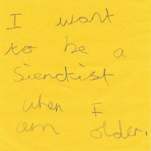 Post-it saying "I want to be a scientist when I am older"