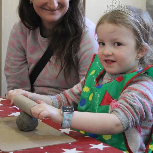 child playing with clay