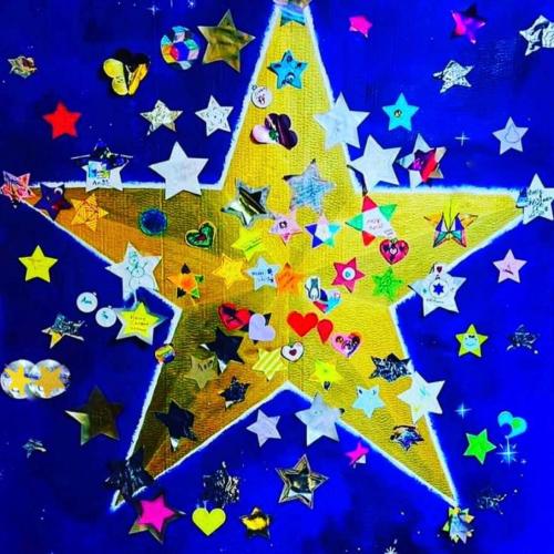 St Albans Community star made up of lots of shiny objects on a golden star