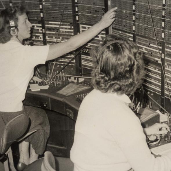 Black and white photo of women at a switchboard