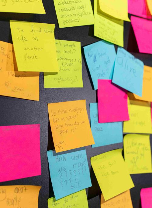 close up of lots of post-its with feedback on