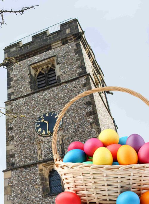 Photograph of clock tower with basket of easter eggs in foreground