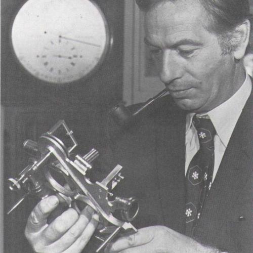 Frank ‘Tony’ Mercer, Thomas Mercer’s son, is shown here holding a sextant with Thomas Mercer’s regulator in the background. © Thomas Arcane.