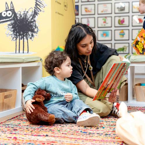 Reading a Rob Biddulph book in the story corner