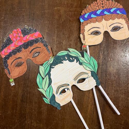 Decorated paper masks on sticks