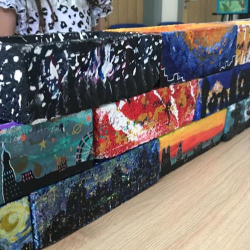 Painted bricks arranged into a wall