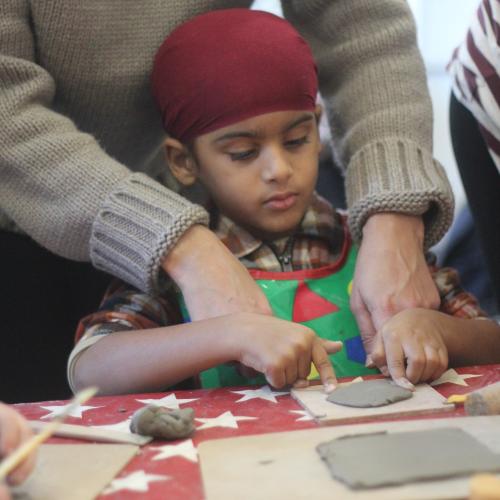child playing with clay