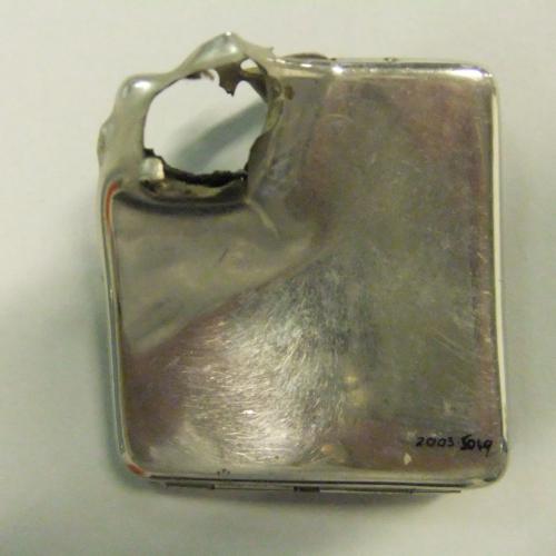 Nickel cigarette case with bullet hole