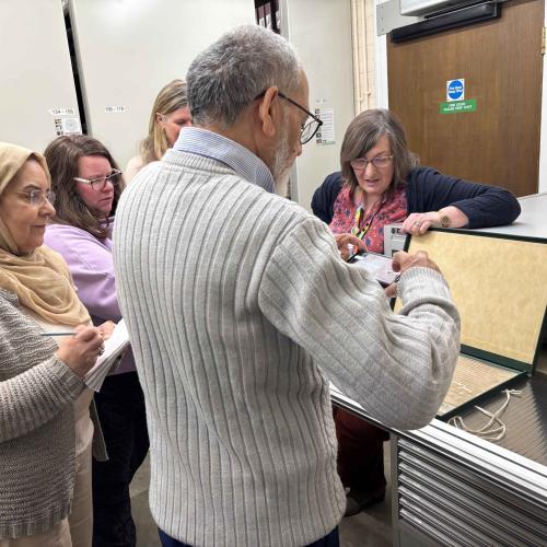 Community researchers viewing ancient documents at HALS