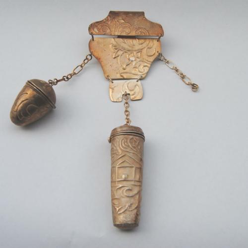 Jewellery for Henrietta, silver antique-like object featuring chains and pendants