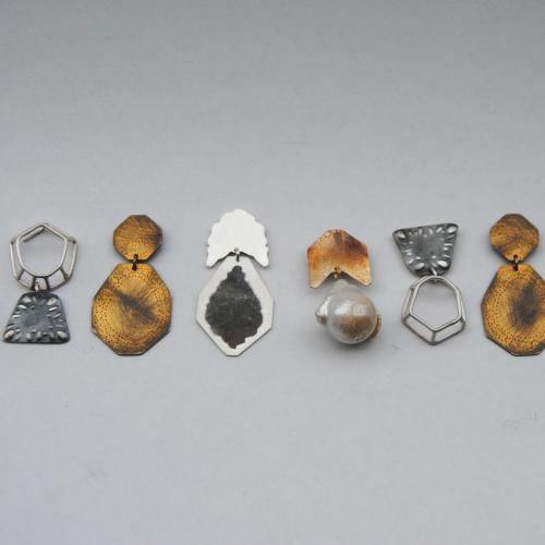 Shadow Earrings, eight single pendant earrings made of various materials