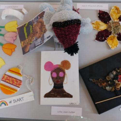 Rainbow Trail artworks in display in a case