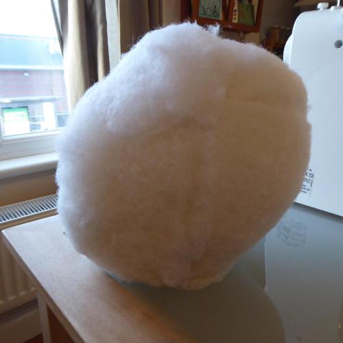 Photo of process of making the mannequin head bigger using polyester