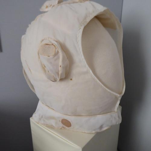 Photo of the inner helmet liner displayed on the mannequin head and displayed