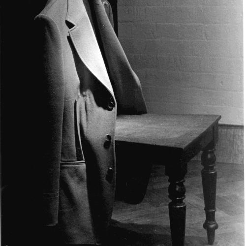 A jacket resting on an empty chair