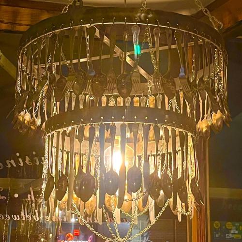 A chandelier made of cutlery