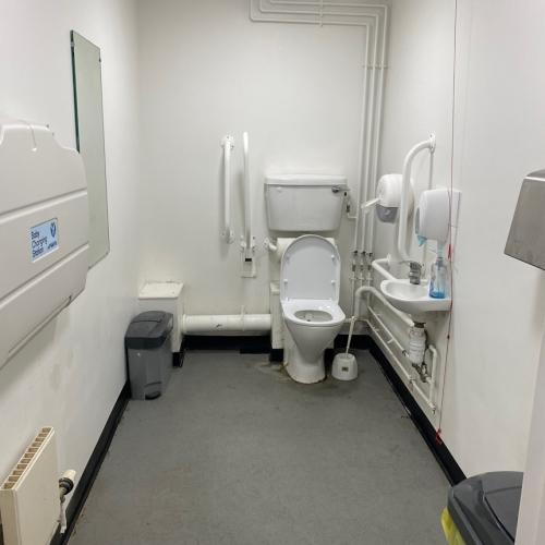 An accessible bathroom with a toilet and a sink