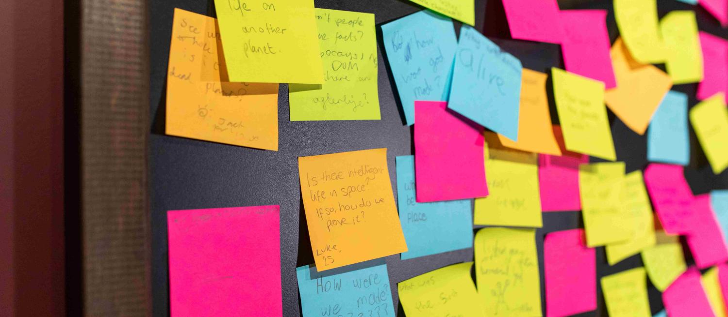 close up of lots of post-its with feedback on