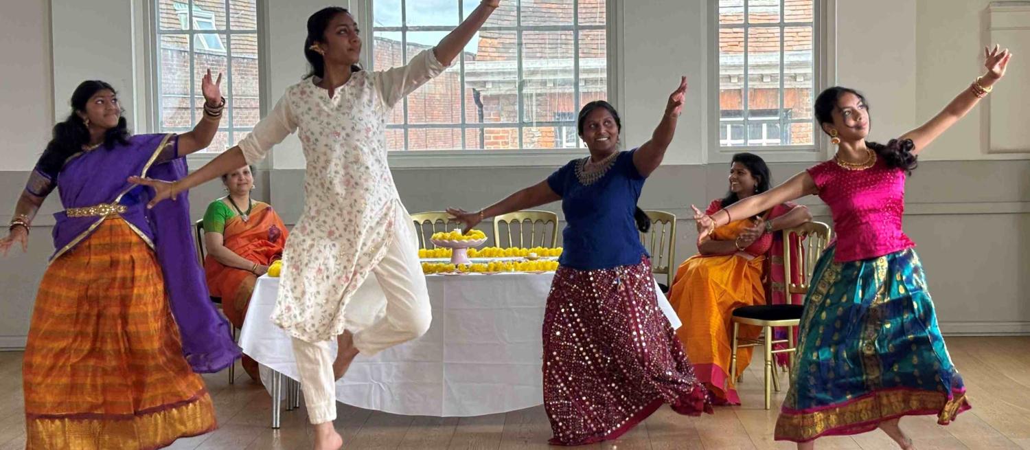 Four Bharatanatyam dancers dancing within the Assembly Room at St Albans Museum + Gallery