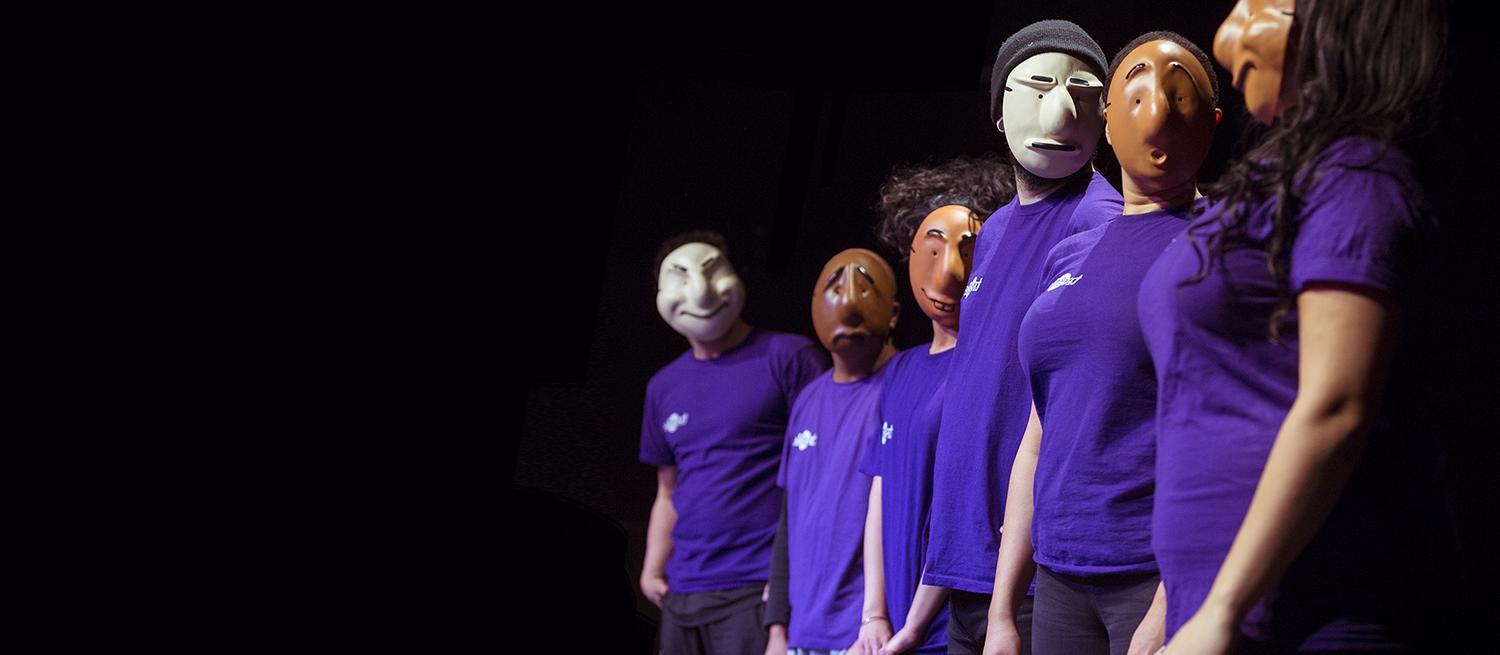 Members of Trestle Theatre Company wearing the Trestle masks
