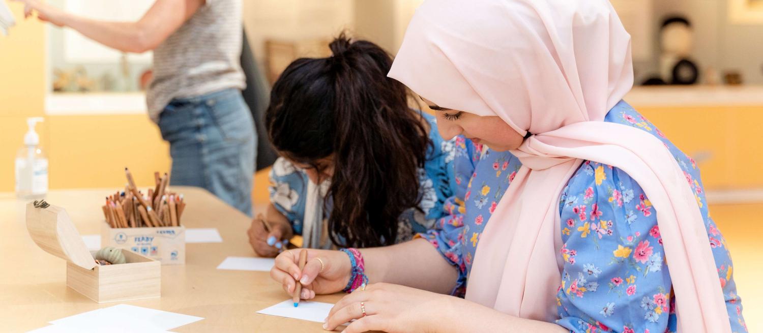 Two women drawing in the museum