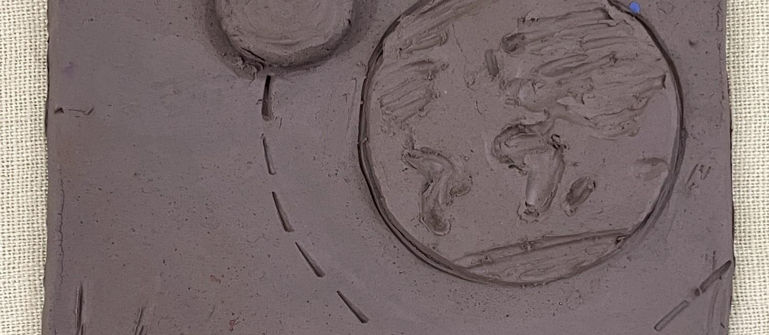 Earth and moon on clay