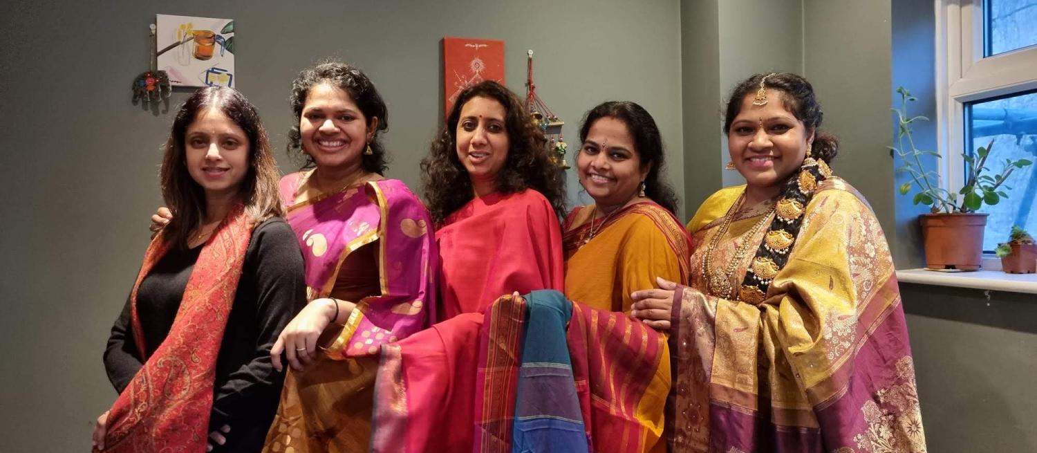 Group of south asian women standing in a line