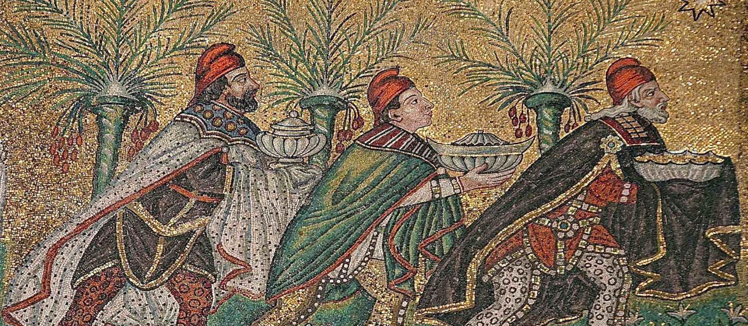 Three men wearing pilleī (red pointy hats)