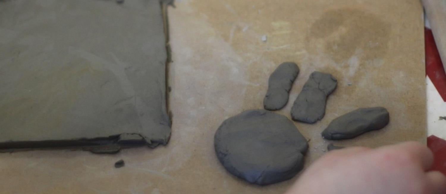 hand of child playing with clay