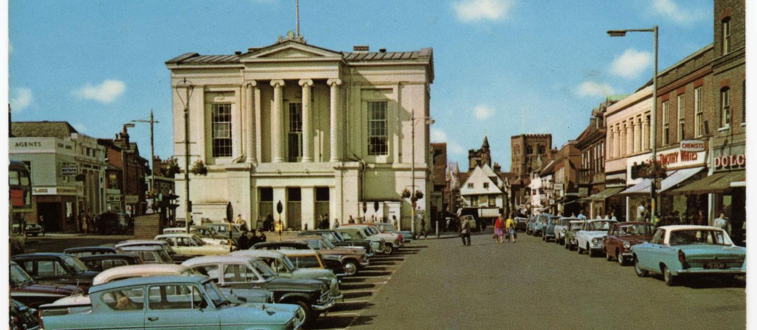 Colour photograph of St Albans Town Hall in the 1960s with cars parked in front of the building
