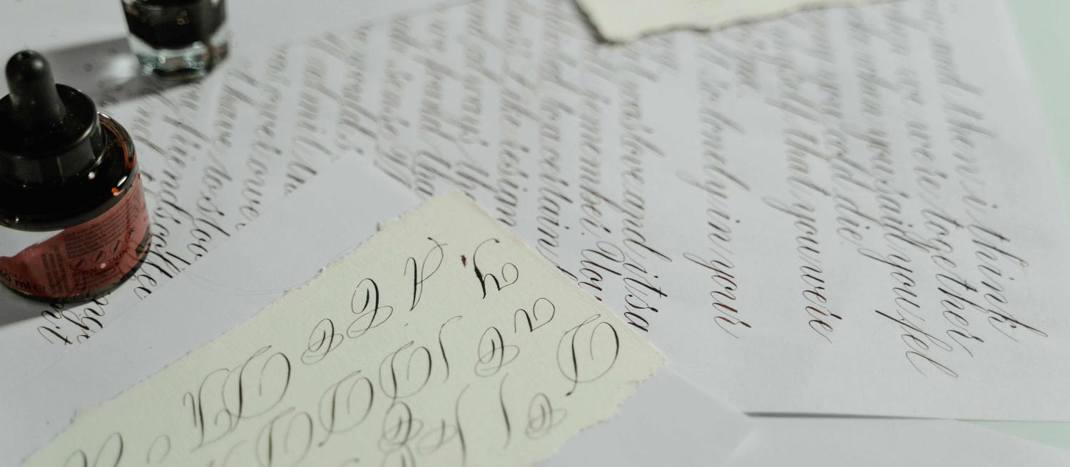 sheets of paper showing calligraphy