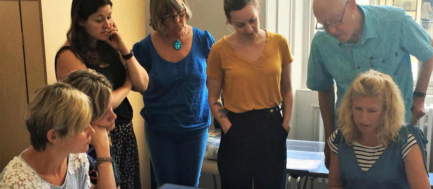 adults learning from artist