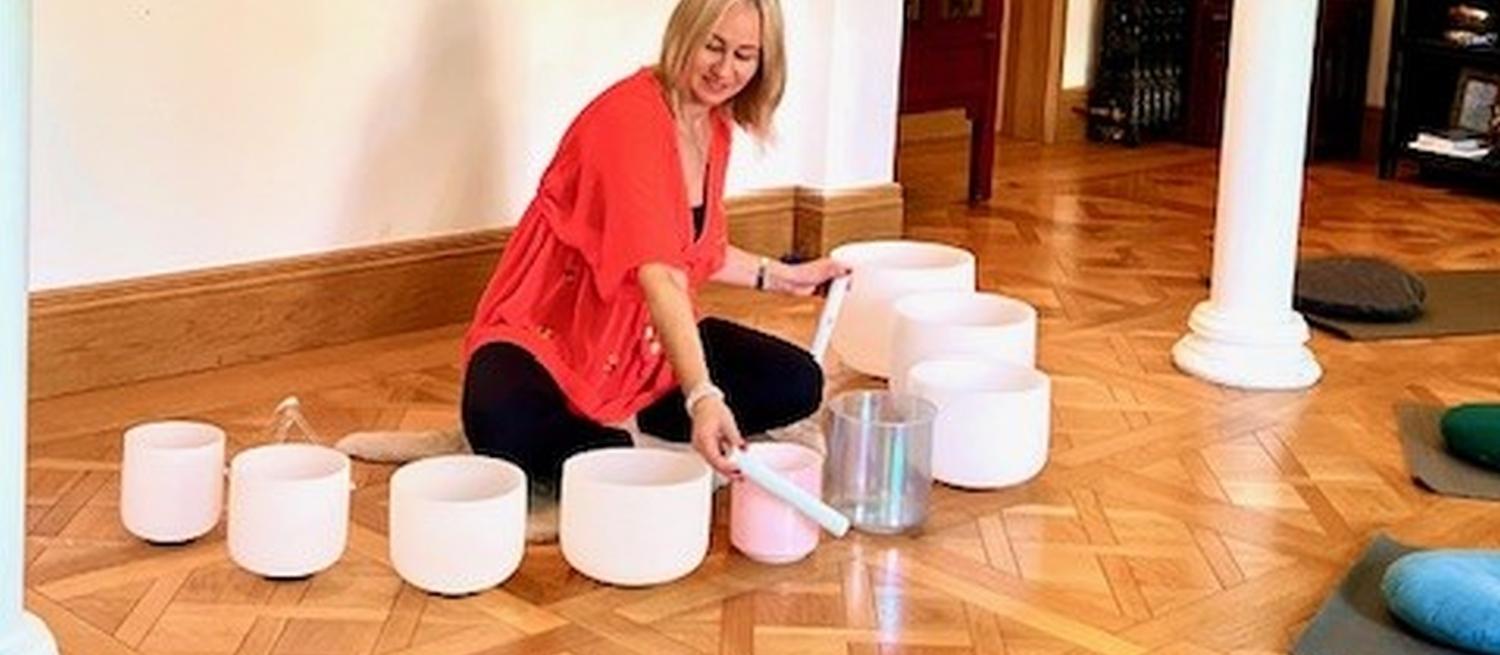 singing bowls being played in a yoga studio