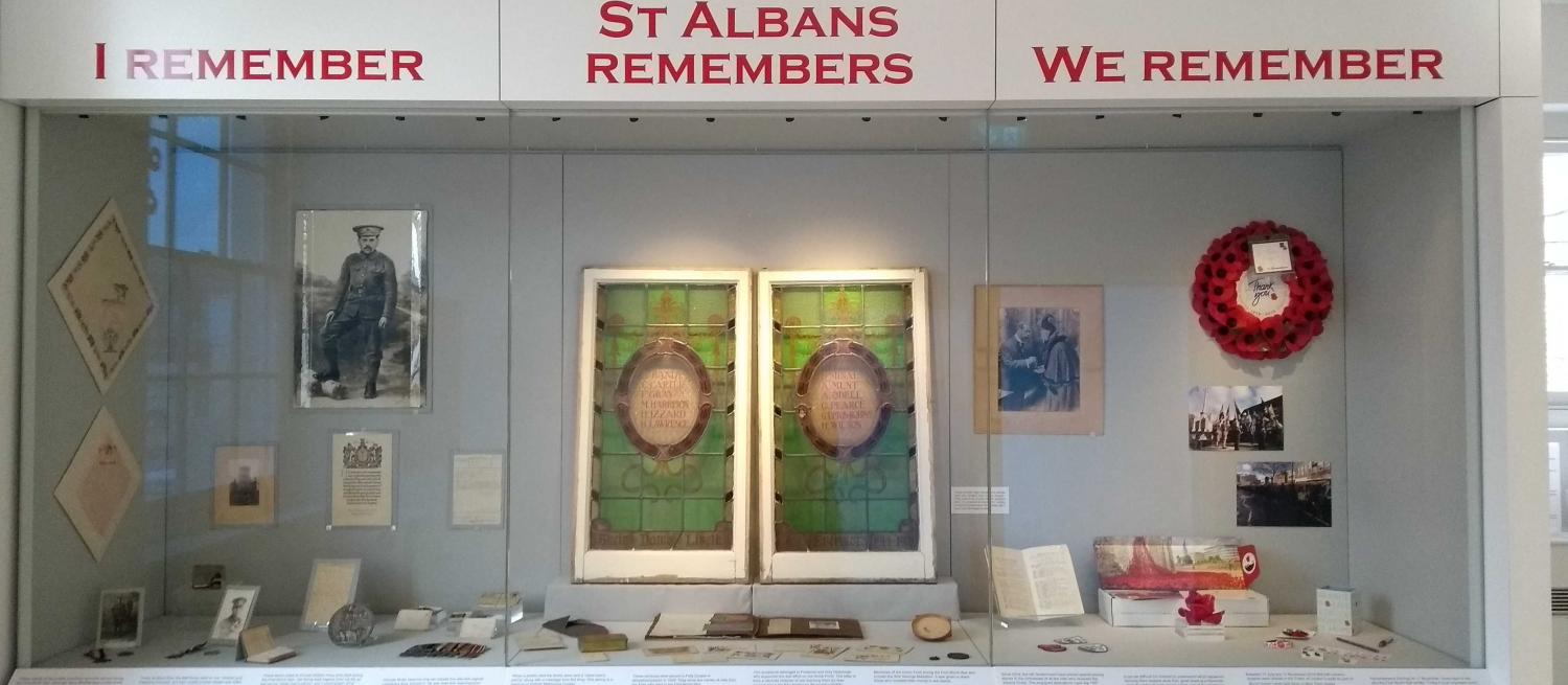 Museum display csaes with I Remember, St Albans Remembers, We Remember written above them