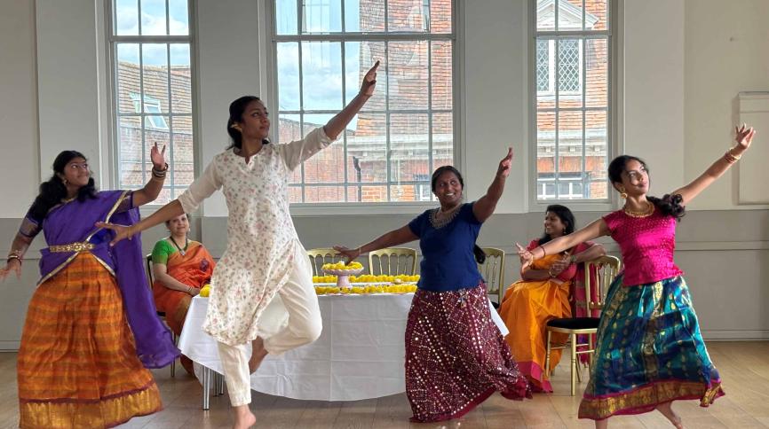 Four Bharatanatyam dancers dancing within the Assembly Room at St Albans Museum + Gallery