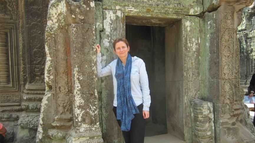 woman standing in an ancient stone doorway