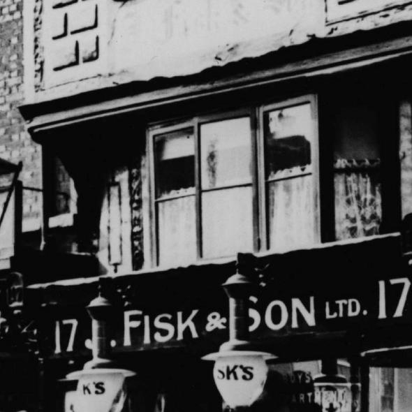 Monochrome photographic print showing Fisk & Son’s shop at 17 High Street, St Albans