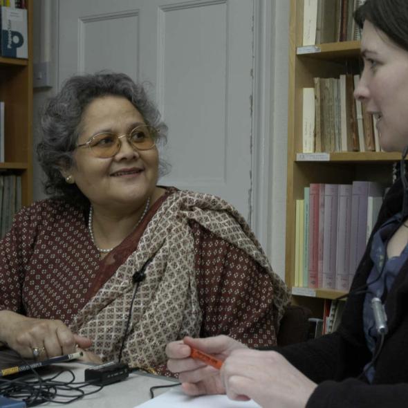 photographic image of two  women, one is interviewing the other 