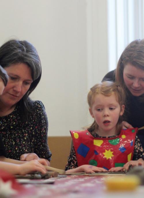 families enjoying craft activities