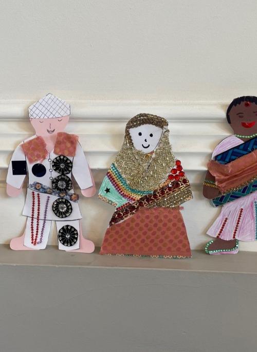 Six paper dolls dressed in various South Asian attire showing various South Asian traditional clothing.
