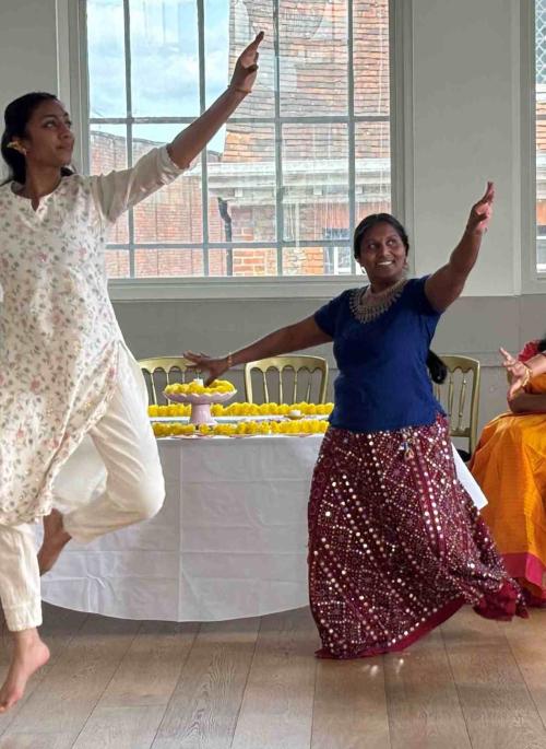 Four Bharatanatyam dancers dancing within the Assembly Room at St Albans Museum + Gallery