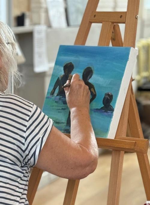 Woman painting on an easel