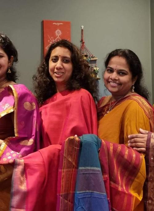 Group of south asian women standing in a line