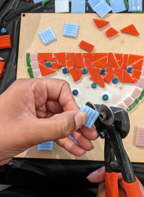 someone making a watermelon mosaic
