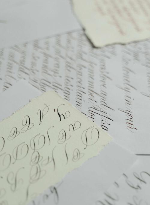 sheets of paper showing calligraphy
