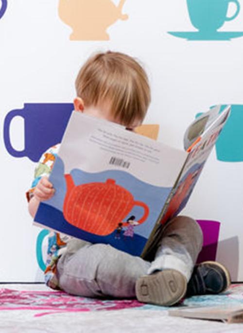 Child reading in Time For Tea