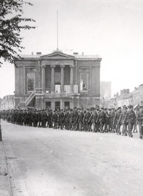 First World War soldiers marching in front of St Albans Town Hall