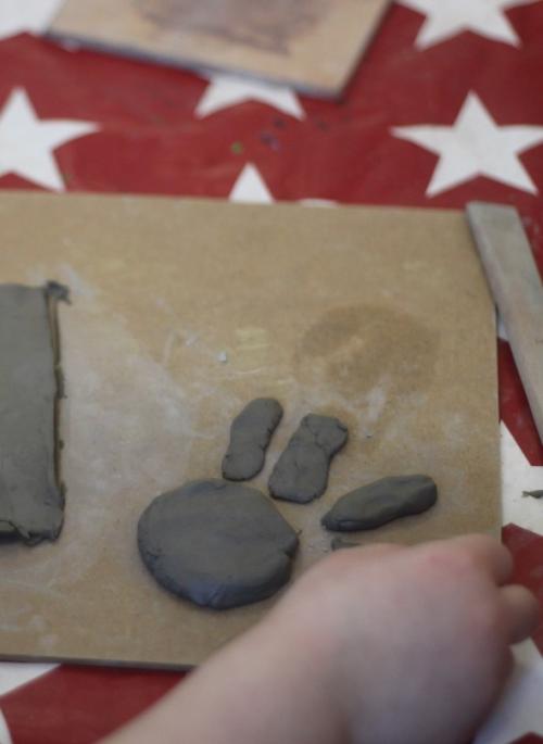 hand of child playing with clay