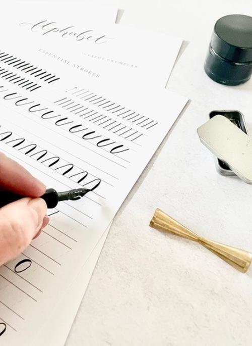 person practising calligraphy